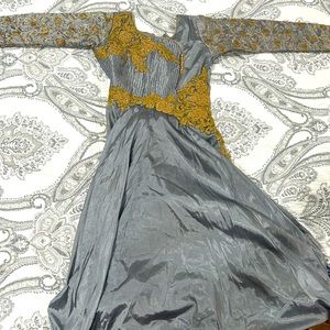 A nice dark blue gray dress with gold accents